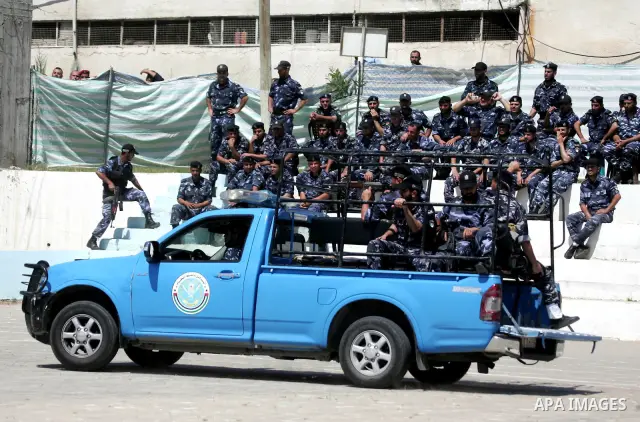 Palestinian Hamas security forces show their skills during a graduation ceremony at the Arafat police compound in Gaza City on May 10, 2011. Photo by Mohammed Othman