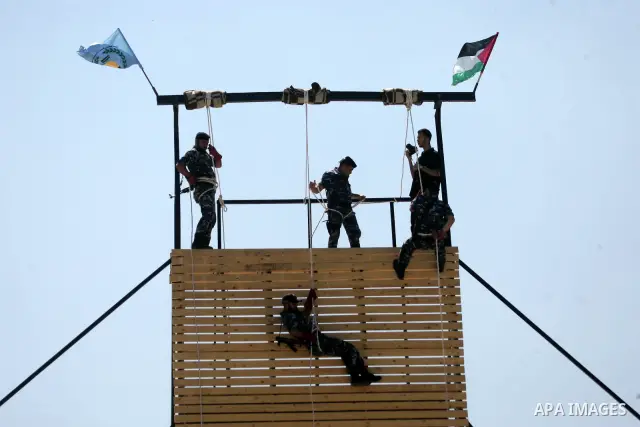 Palestinian Hamas security forces show their skills during a graduation ceremony at the Arafat police compound in Gaza City on May 10, 2011. Photo by Mohammed Othman