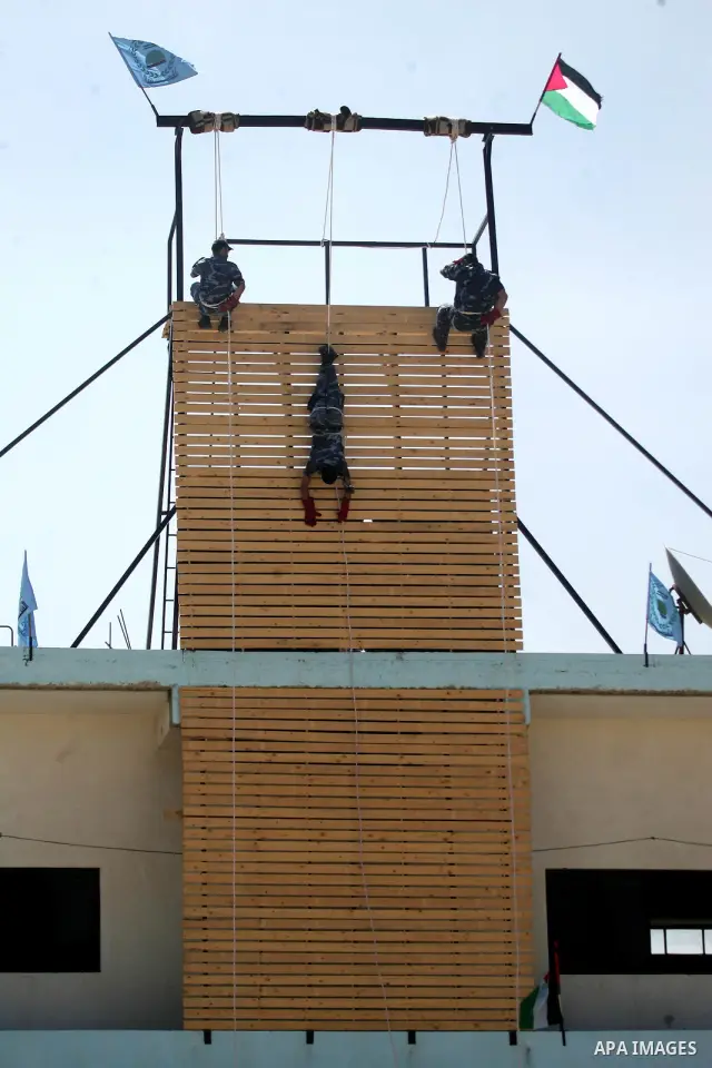 Palestinian Hamas security forces show their skills during a graduation ceremony at the Arafat police compound in Gaza City on May 10, 2011. Photo by Mohammed Othman