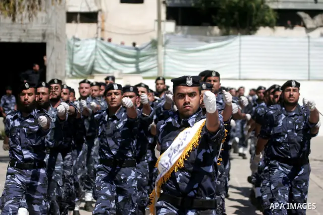 palestinian Hamas security forces march with their riot gear during a graduation ceremony at the Arafat police compound in Gaza City on May 10, 2011. Photo by Mohammed Othman