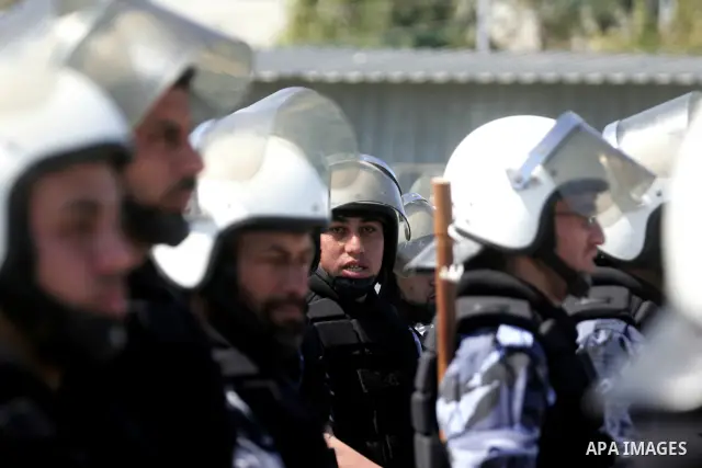 palestinian Hamas security forces march with their riot gear during a graduation ceremony at the Arafat police compound in Gaza City on May 10, 2011. Photo by Mohammed Othman