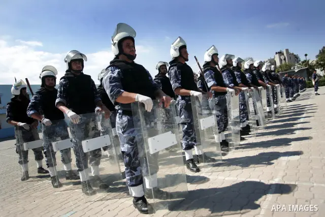 palestinian Hamas security forces march with their riot gear during a graduation ceremony at the Arafat police compound in Gaza City on May 10, 2011. Photo by Mohammed Othman