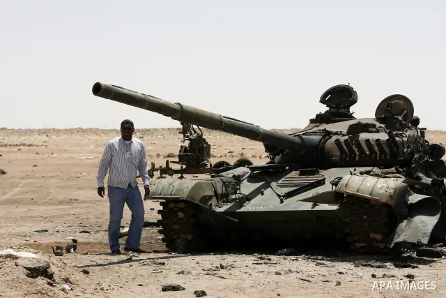 Libyan rebel fighters head towards the front line outside the Libyan eastern city Ajdabiya on May 10, 2011, where fighting between rebels and forces loyal to leader Moamer Kadhafi is ongoing. Photo by Wissam Nassar