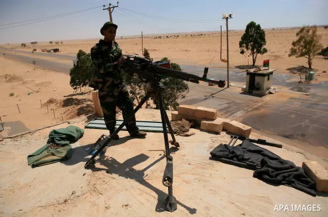 Libyan rebel fighters head towards the front line outside the Libyan eastern city Ajdabiya on May 10, 2011, where fighting between rebels and forces loyal to leader Moamer Kadhafi is ongoing. Photo by Wissam Nassar