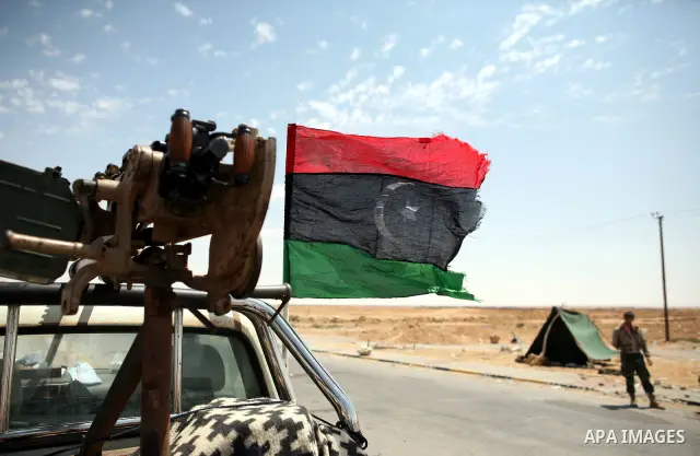 Libyan rebel fighters head towards the front line outside the Libyan eastern city Ajdabiya on May 10, 2011, where fighting between rebels and forces loyal to leader Moamer Kadhafi is ongoing. Photo by Wissam Nassar
