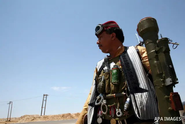 Libyan rebel fighters head towards the front line outside the Libyan eastern city Ajdabiya on May 10, 2011, where fighting between rebels and forces loyal to leader Moamer Kadhafi is ongoing. Photo by Wissam Nassar