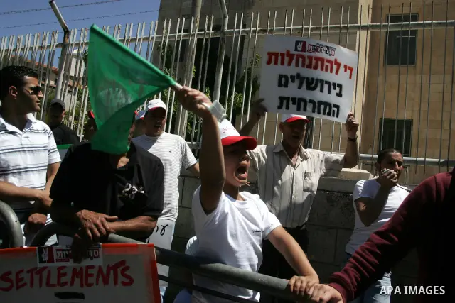Palestinians participate in a demonstration supporting Palestinians evicted from their homes in the east Jerusalem on May 11, 2011, outside Jerusalem District Court against the city's plan to destroy homes in Silwan neig...