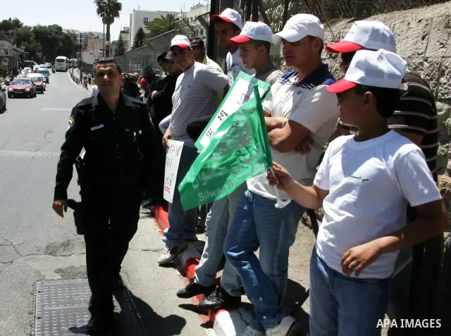 Palestinians participate in a demonstration supporting Palestinians evicted from their homes in the east Jerusalem on May 11, 2011, outside Jerusalem District Court against the city's plan to destroy homes in Silwan neig...