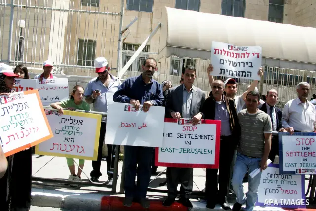 Palestinians participate in a demonstration supporting Palestinians evicted from their homes in the east Jerusalem on May 11, 2011, outside Jerusalem District Court against the city's plan to destroy homes in Silwan neig...