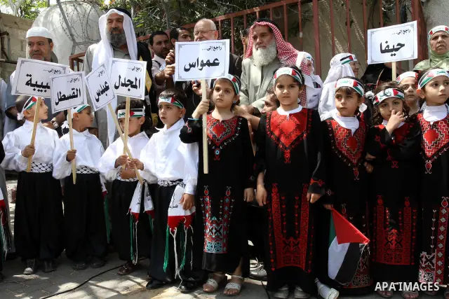 Palestinian children take part in a Nakba rally in Gaza City May 12, 2011. Palestinians will mark "Nakba" (Catastrophe) on May 15 to commemorate the time when hundreds of thousands of Palestinians were expelled or fled f...