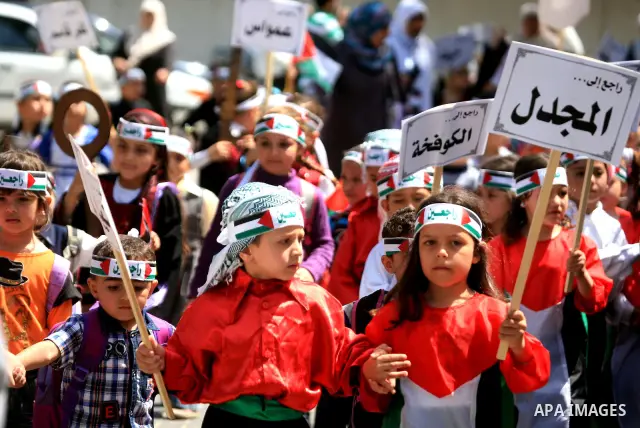Palestinian children take part in a rally marking the 63rd anniversary of the 'Nakba', or 'Catastrophe', in Gaza City, Thursday, May 12, 2011. Hundreds of thousands of Palestinians were uprooted in the 1948 war that led...