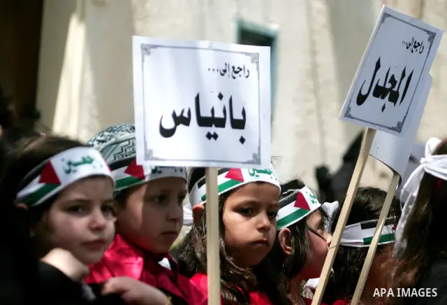 Palestinian children take part in a rally marking the 63rd anniversary of the 'Nakba', or 'Catastrophe', in Gaza City, Thursday, May 12, 2011. Hundreds of thousands of Palestinians were uprooted in the 1948 war that led...