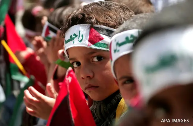 Palestinian children take part in a rally marking the 63rd anniversary of the 'Nakba', or 'Catastrophe', in Gaza City, Thursday, May 12, 2011. Hundreds of thousands of Palestinians were uprooted in the 1948 war that led...