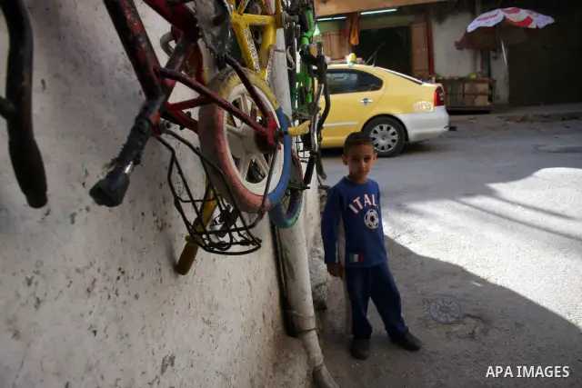 Palestinian children walk at streets of the Amari refugee camp, near Ramallah in the West Bank 12 May 2011. Nakba means "catastrophe" in reference to the birth of the state of Israel 63 years ago in British-mandate Pales...