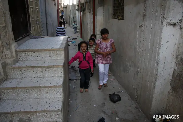 Palestinian children walk at streets of the Amari refugee camp, near Ramallah in the West Bank 12 May 2011. Nakba means "catastrophe" in reference to the birth of the state of Israel 63 years ago in British-mandate Pales...
