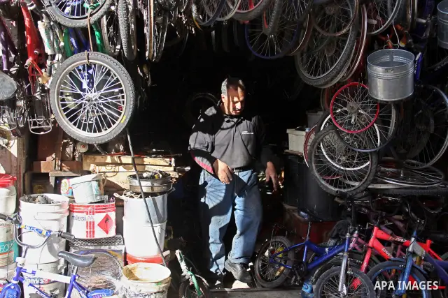 A Palestinian man Displays old equipment in his shop in the Amari refugee camp, near Ramallah in the West Bank 12 May 2011. Nakba means "catastrophe" in reference to the birth of the state of Israel 63 years ago in Briti...