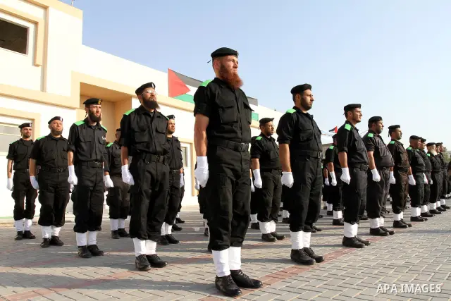 Palestinian Hamas security forces stand at attention during a graduation ceremony at the Ansar police compound in Gaza City on May 12, 2011. Photo by Mohammed Asad
