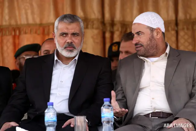Palestinians prime minister in Gaza Strip, Ismail Haniyah watch Hamas security forces march during a graduation ceremony at the Ansar police compound in Gaza City on May 12, 2011. Photo by Mohammed Asad
