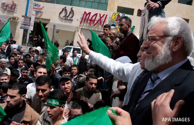 Palestinian parliament speaker, Aziz Dweik and Hamas members of the Palestinian Legislative Council (PLC) take part in a rally to mark the 63th anniversary of "Nakba" (catastrophe) on May 13, 2011 in the West Bank city o...