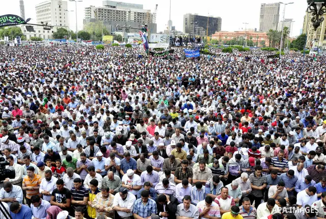 Egyptians attend Friday prayers at a rally at Cairo's Tahrir Square on May 13, 2011 during a protest calling for national unity after attacks on Egyptian churches, and solidarity with the Palestinians as they mark the "N...