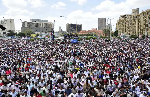 Egyptians attend Friday prayers at a rally at Cairo's Tahrir Square on May 13, 2011 during a protest calling for national unity after attacks on Egyptian churches, and solidarity with the Palestinians as they mark the "N...