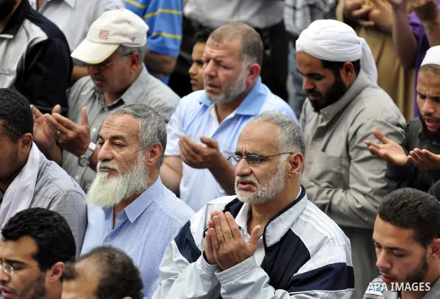 Egyptians attend Friday prayers at a rally at Cairo's Tahrir Square on May 13, 2011 during a protest calling for national unity after attacks on Egyptian churches, and solidarity with the Palestinians as they mark the "N...