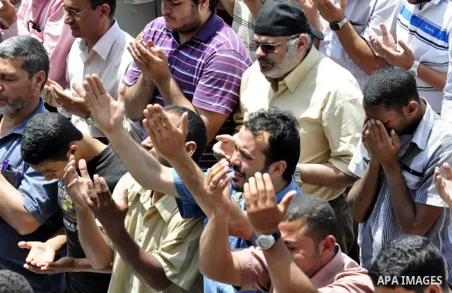 Egyptians attend Friday prayers at a rally at Cairo's Tahrir Square on May 13, 2011 during a protest calling for national unity after attacks on Egyptian churches, and solidarity with the Palestinians as they mark the "N...