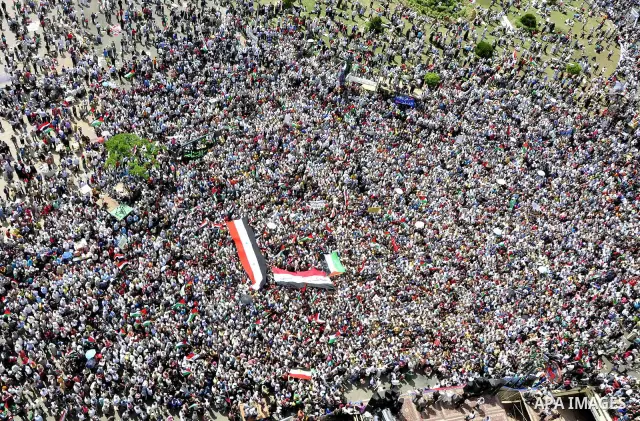 Egyptian demonstrators wave Palestinian flags and Egyptian flags during a rally at Cairo's Tahrir Square on May 13, 2011 during a protest calling for national unity after attacks on Egyptian churches, and solidarity with...