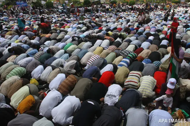 Egyptians attend Friday prayers at a rally at Cairo's Tahrir Square on May 13, 2011 during a protest calling for national unity after attacks on Egyptian churches, and solidarity with the Palestinians as they mark the "N...