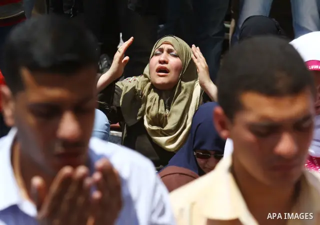 Egyptians attend Friday prayers at a rally at Cairo's Tahrir Square on May 13, 2011 during a protest calling for national unity after attacks on Egyptian churches, and solidarity with the Palestinians as they mark the "N...