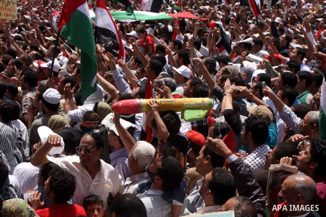 An Egyptian child holds a mock Qassam rocket during a rally at Cairo's Tahrir Square on May 13, 2011 during a protest calling for national unity after attacks on Egyptian churches, and solidarity with the Palestinians as...