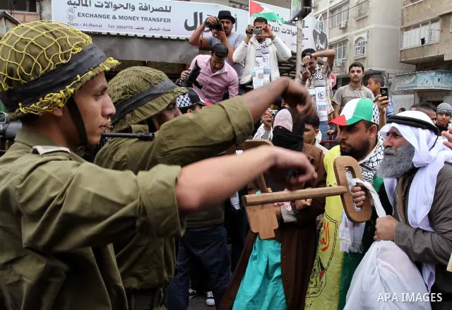 Palestinians Artists take part in a demonstration to mark the 63th anniversary of "Nakba" (catastrophe), in Gaza city, on May 14, 2011. Through the display of theatrical sketch. Nakba means "catastrophe" in reference to...