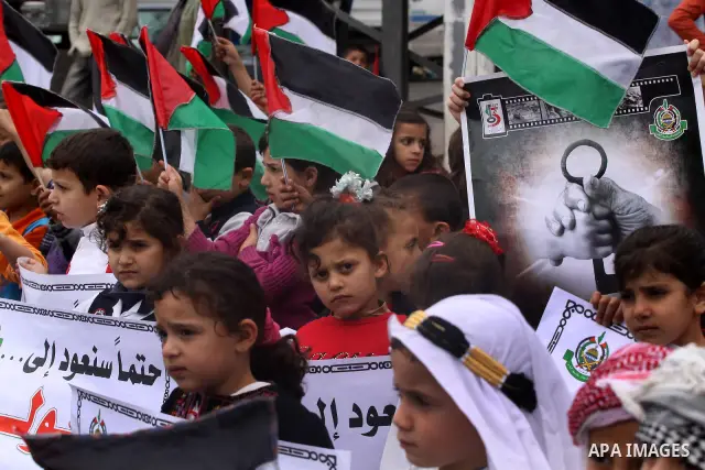 Palestinian children take part in a rally marking the 63rd anniversary of the 'Nakba', or 'Catastrophe', in Gaza City, Saturday, May 14, 2011. Hundreds of thousands of Palestinians were uprooted in the 1948 war that led...