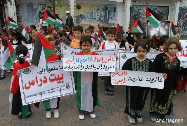 Palestinian children take part in a rally marking the 63rd anniversary of the 'Nakba', or 'Catastrophe', in Gaza City, Saturday, May 14, 2011. Hundreds of thousands of Palestinians were uprooted in the 1948 war that led...