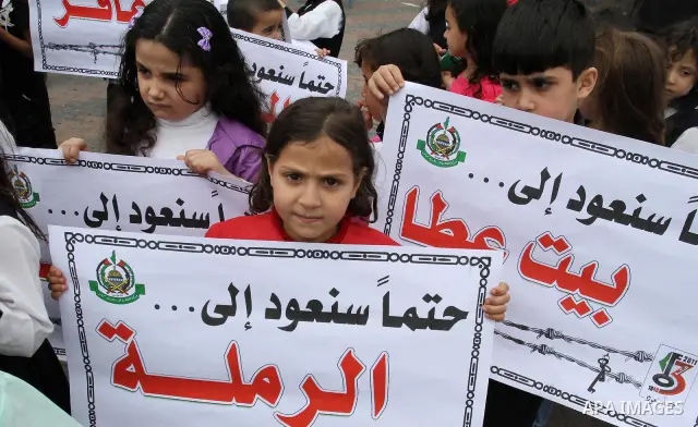 Palestinian children take part in a rally marking the 63rd anniversary of the 'Nakba', or 'Catastrophe', in Gaza City, Saturday, May 14, 2011. Hundreds of thousands of Palestinians were uprooted in the 1948 war that led...