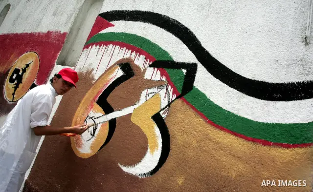 Palestinian Artists take part in paint a murals to mark the 63th anniversary of "Nakba" (catastrophe), in Gaza City, on May 14, 2011. Hundreds of thousands of Palestinians were uprooted in the 1948 war that led to Israel...