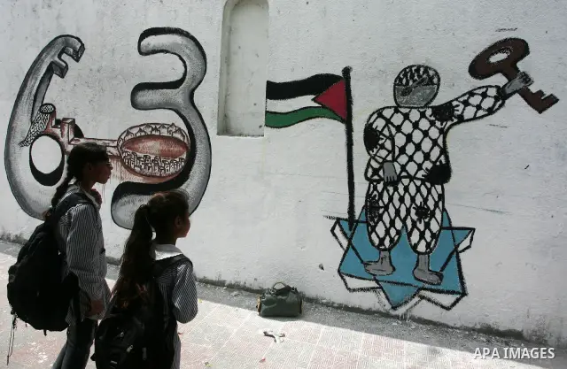 Palestinian Artists take part in paint a murals to mark the 63th anniversary of "Nakba" (catastrophe), in Gaza City, on May 14, 2011. Hundreds of thousands of Palestinians were uprooted in the 1948 war that led to Israel...