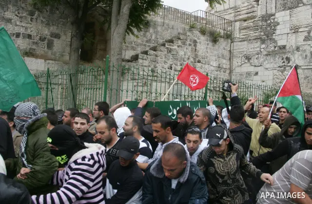 Mourners carry the body of Milad Ayyash, a Palestinian teenager who died after being shot as Palestinians launched events to mourn the 1948 creation of the Jewish state in Jerusalem the day before, during his funeral pro...