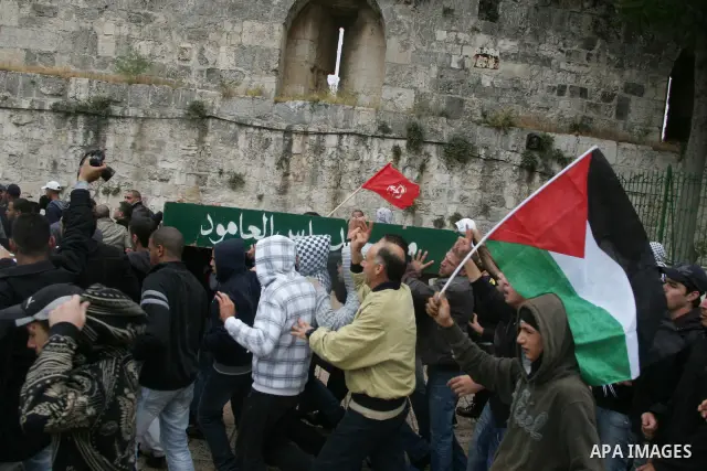 Mourners carry the body of Milad Ayyash, a Palestinian teenager who died after being shot as Palestinians launched events to mourn the 1948 creation of the Jewish state in Jerusalem the day before, during his funeral pro...