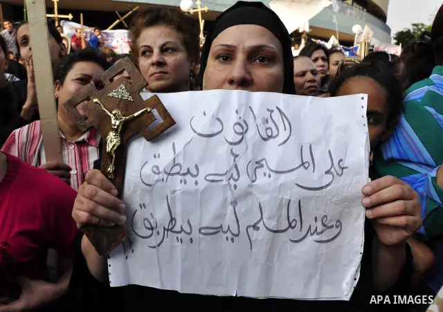 Egyptian Coptic Christians protest in front of the state television building in Cairo on May 14, 2011 against recent attempts to trigger sectarian conflict in the country. Photo by Ahmed Asad