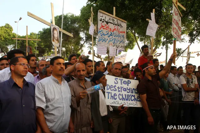 Egyptian Coptic Christians protest in front of the state television building in Cairo on May 14, 2011 against recent attempts to trigger sectarian conflict in the country. Photo by Ashraf Amra