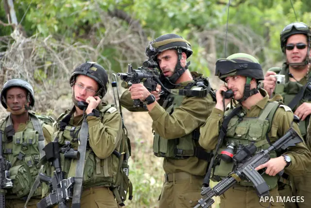 Israeli soldiers shoot the youths Palestinian during clashes in the West Bank city of Hebron on May 15, 2011, while Palestinians mourned on May 15, 2011 the "nakbah" anniversary of Israel's creation in 1948, as a result...