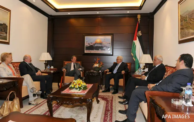 Palestinian President Mahmoud Abbas (Abu Mazen) during a meeting with the prime FIFA World Football Federation, Mr. Blatter, and Prince Ali bin Hussein, head of the Jordanian Federation of football in the west bank city...