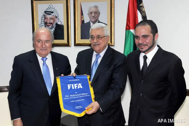 Palestinian President Mahmoud Abbas (Abu Mazen) during a meeting with the prime FIFA World Football Federation, Mr. Blatter, and Prince Ali bin Hussein, head of the Jordanian Federation of football in the west bank city...