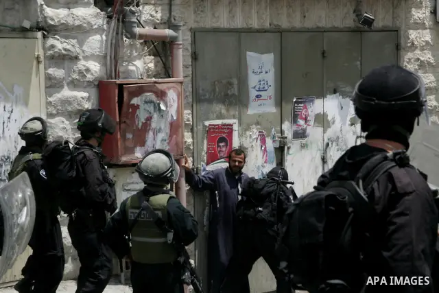 Israeli riot and undercover policemen arrest a Palestinian protester during clashes in the east Jerusalem Arab neighborhood of Issawiya on May 15, 2011 while heavy clashes broke out near Ramallah in the West Bank when yo...