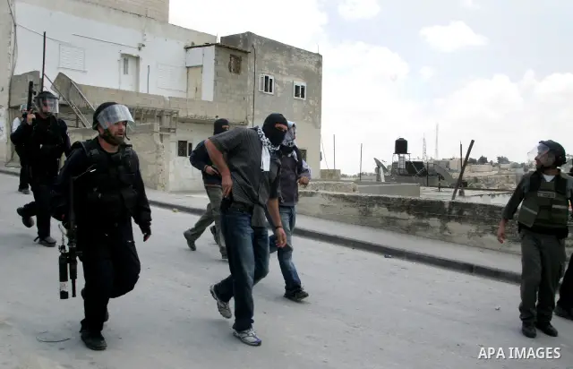 Israeli riot and undercover policemen take position during clashes with Palestinian protesters in the east Jerusalem Arab neighborhood of Issawiya on May 15, 2011 while heavy clashes broke out near Ramallah in the West B...
