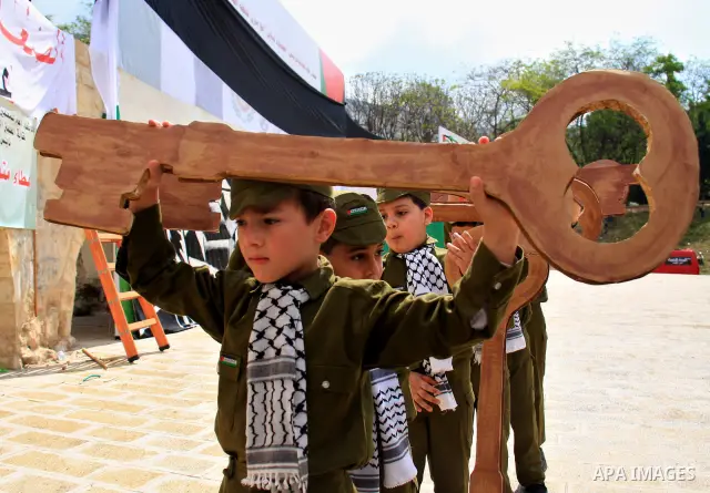 Palestinian children, some of them holding symbolic keys representing the keys to their homes snatched when the state of Israel was created, attend a rally to mark the day of "nakba" or the catastrophe on May 15, 2011 in...