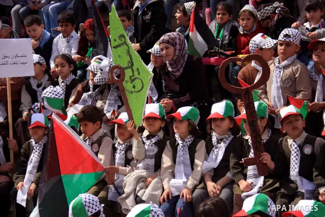 Palestinian children, some of them holding symbolic keys representing the keys to their homes snatched when the state of Israel was created, attend a rally to mark the day of "nakba" or the catastrophe on May 15, 2011 in...