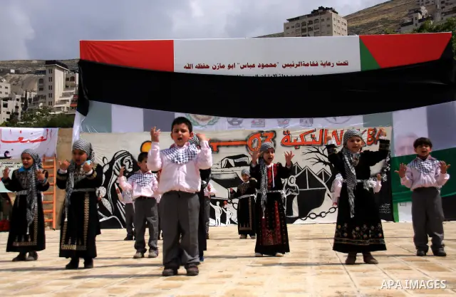 Palestinian children attend a rally to mark the day of "nakba" or the catastrophe on May 15, 2011 in the Israeli occupied West Bank city of Nablus. Across the West Bank and Palestinian territories rallies are taking plac...
