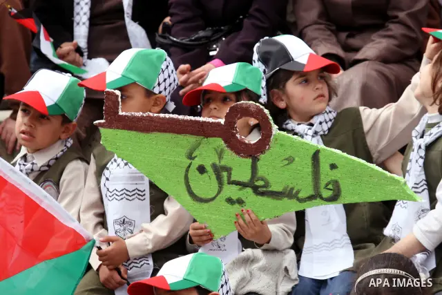 Palestinian children, some of them holding symbolic keys representing the keys to their homes snatched when the state of Israel was created, attend a rally to mark the day of "nakba" or the catastrophe on May 15, 2011 in...